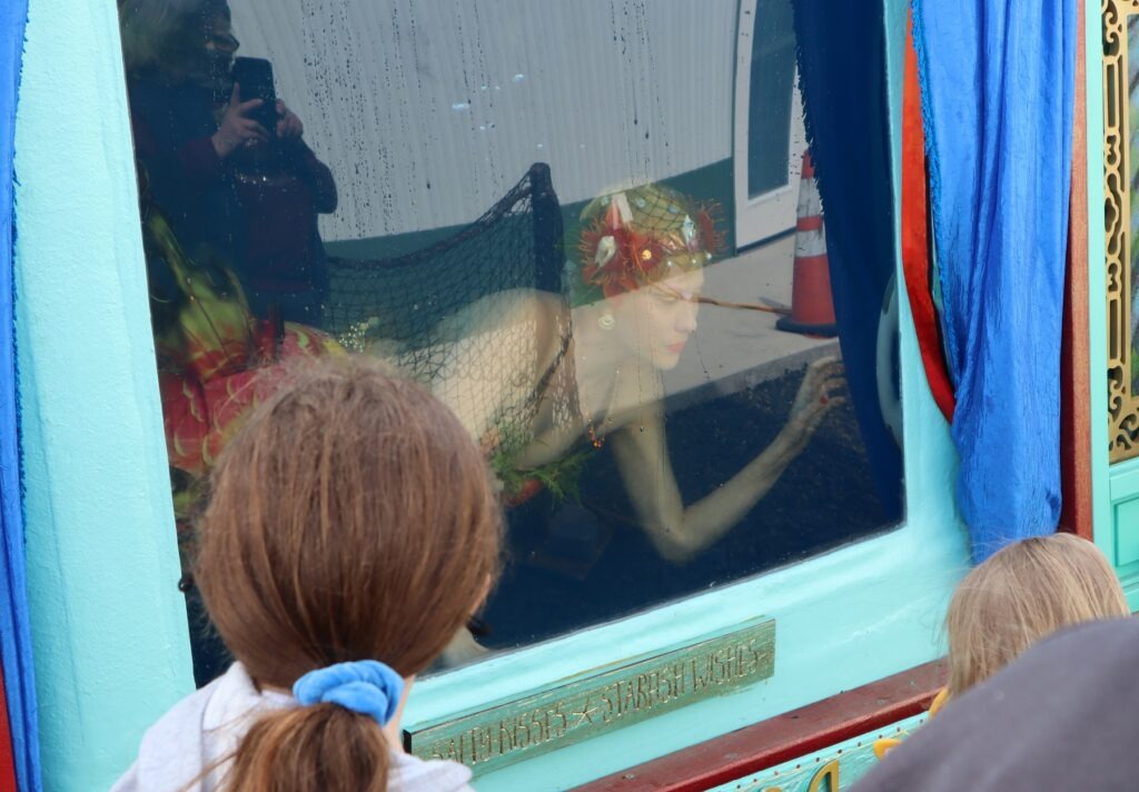 Una the Mermaid mesmerized youngsters who flocked to her traveling show tank, which was parked beside the new museum.