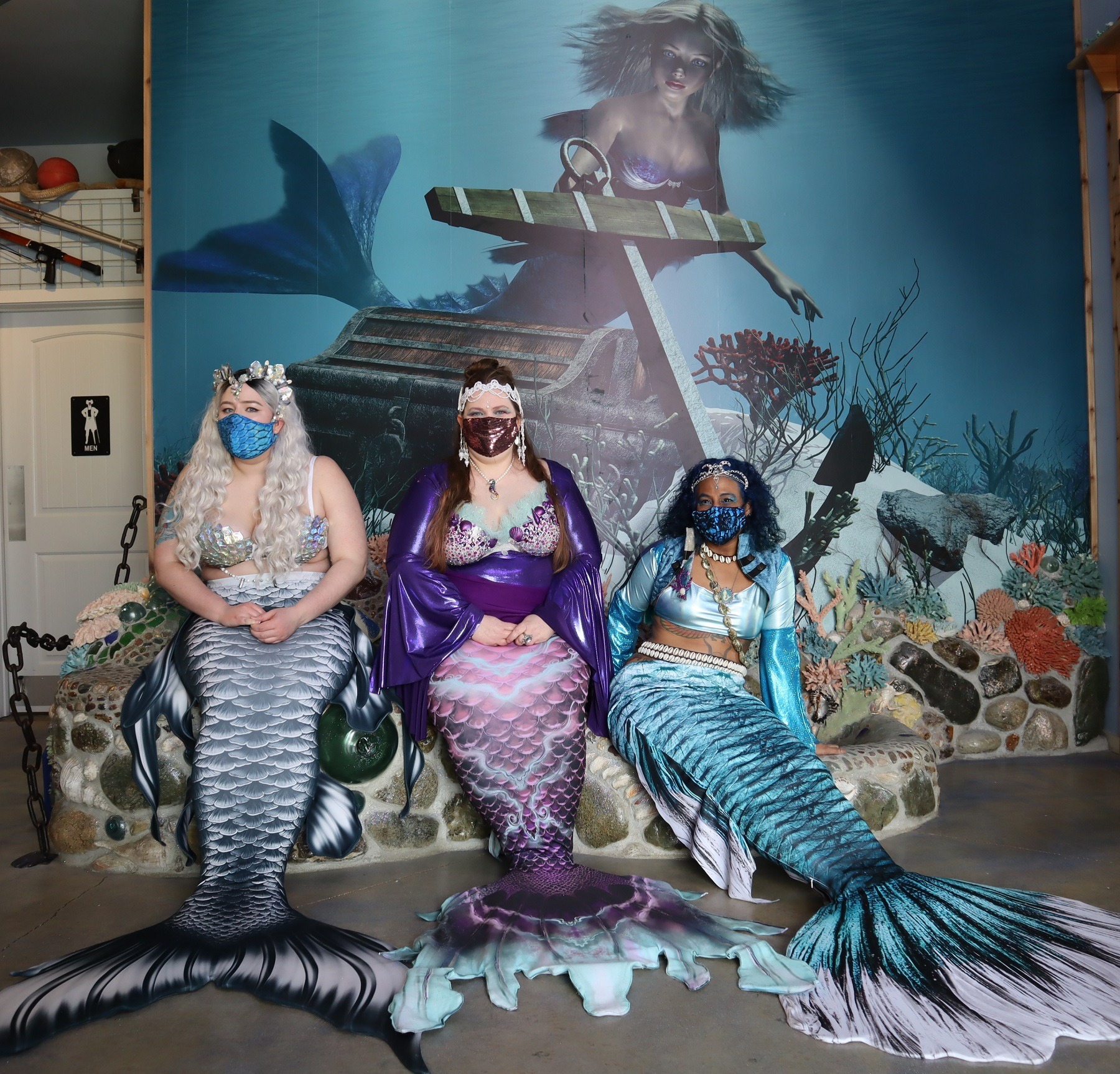 From left, Mermaid Siren Ophelia of Seattle, Mermaid Asherah and Mermaid Merina both of Portland, at the opening of the new International Mermaid Museum near Aberdeen, Washington.