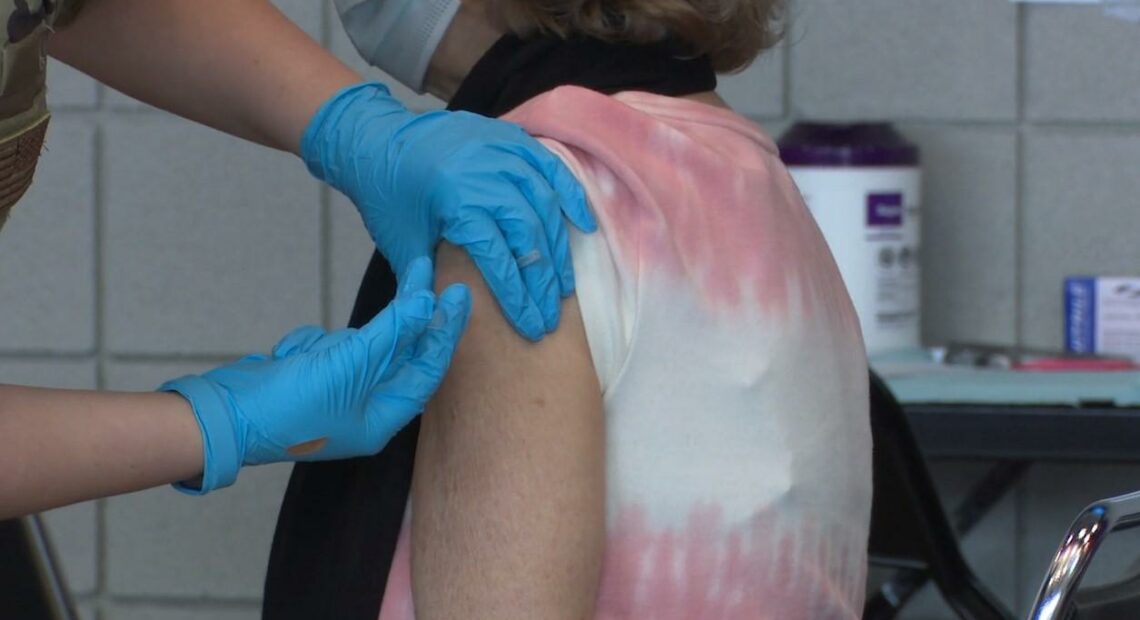 A person gets a COVID-19 vaccine shot at mass clinic in Spokane. Health officials say "breakthrough cases," where those who had the vaccine later get infected with the disease against which they're inoculated, are rare, but can still happen with any vaccine. Courtesy of CHAS Health