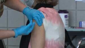 A person gets a COVID-19 vaccine shot at mass clinic in Spokane. Health officials say "breakthrough cases," where those who had the vaccine later get infected with the disease against which they're inoculated, are rare, but can still happen with any vaccine. Courtesy of CHAS Health