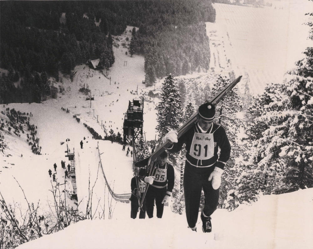 In the heyday of ski jumping at the Leavenworth Ski Hill, competitors climbed a walkway to the top of the large ski jump.