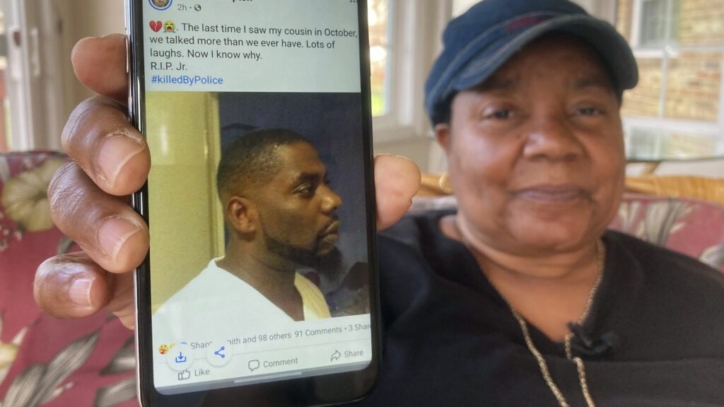 Andrew Brown Jr. was shot in the back of his head, his family's attorneys said Tuesday, citing an independent autopsy. Here, Glenda Brown Thomas displays a photo of Brown, her nephew, on her cellphone at her home in Elizabeth City, N.C. CREDIT: Allen G. Breed/AP