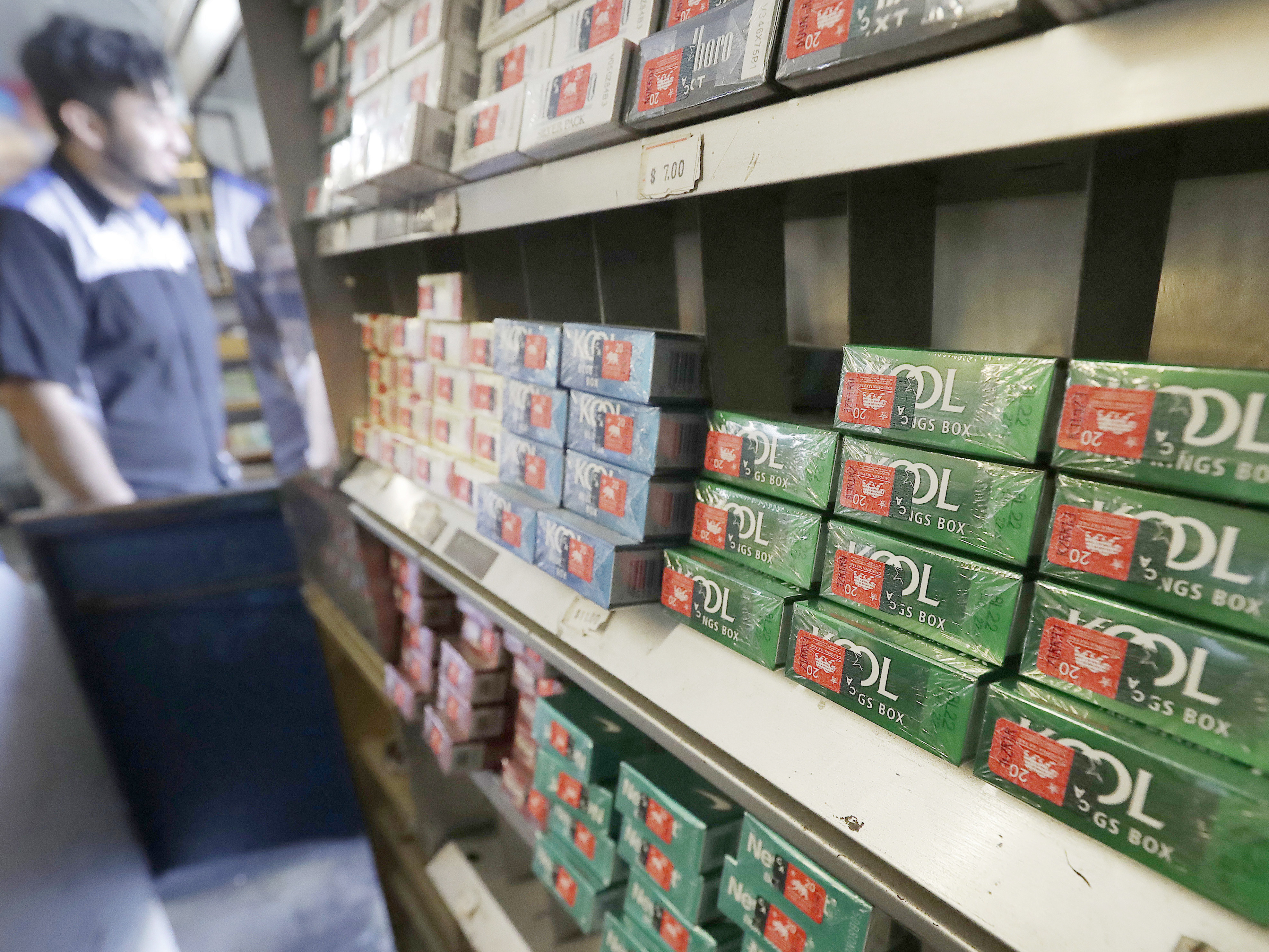 FILE - This May 17, 2018 file photo shows packs of menthol cigarettes and other tobacco products at a store in San Francisco. U.S. health regulators will announce a new effort Thursday, April 29, 2021, to ban menthol cigarettes, according to an Biden administration official.