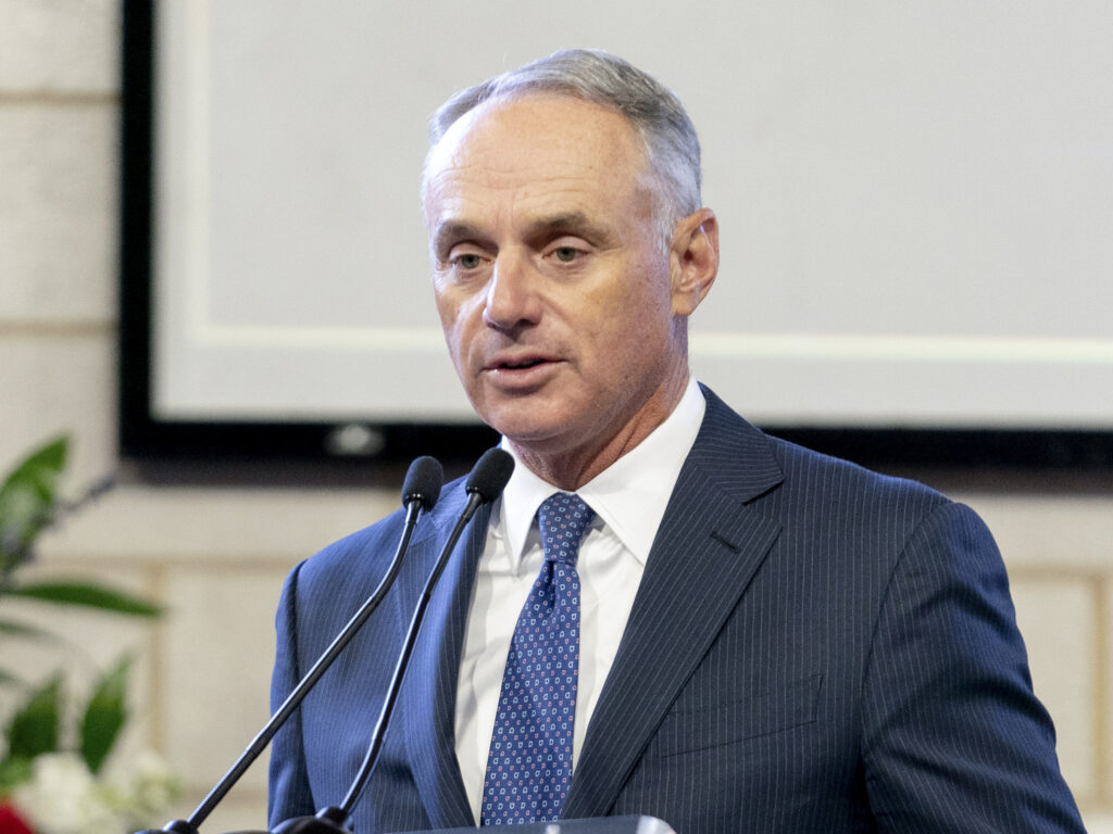 Major League Baseball Commissioner Rob Manfred, pictured in January, on Friday said the organization unwaveringly supports "fair access to voting." Kevin D. Liles/AP