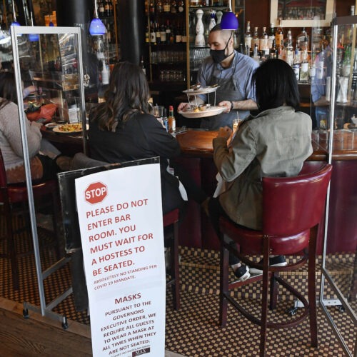 Diners eat lunch at Max's Oyster Bar in West Hartford, Conn., on March 19. Retail sales surged last month as $1,400 relief payments and easing coronavirus restrictions led shoppers to open their wallets. Jessica Hill/AP