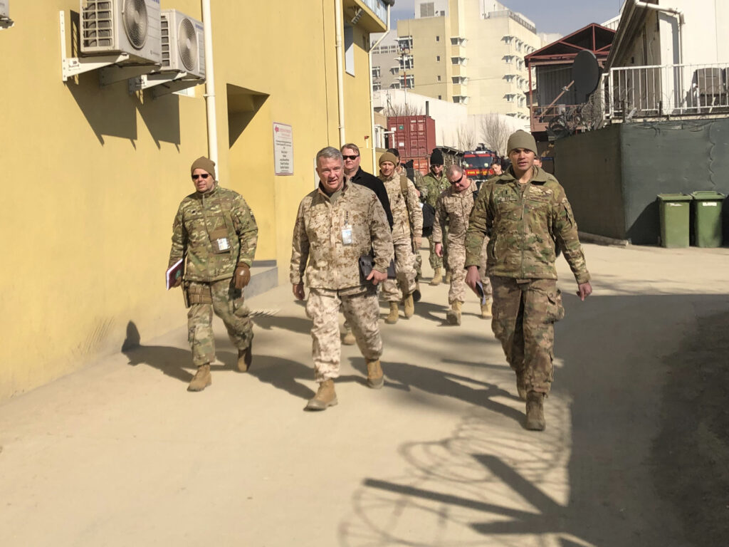 Marine Gen. Frank McKenzie, (center) is shown visiting Kabul, Afghanistan in January 2020. The Biden administration said it plans to complete a draw down of U.S. troops in the country by Sept. 11. CREDIT: Lolita Baldor/AP