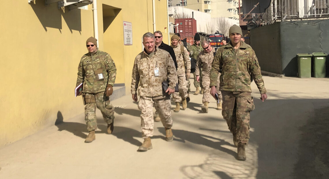 Marine Gen. Frank McKenzie, (center) is shown visiting Kabul, Afghanistan in January 2020. The Biden administration said it plans to complete a draw down of U.S. troops in the country by Sept. 11. CREDIT: Lolita Baldor/AP