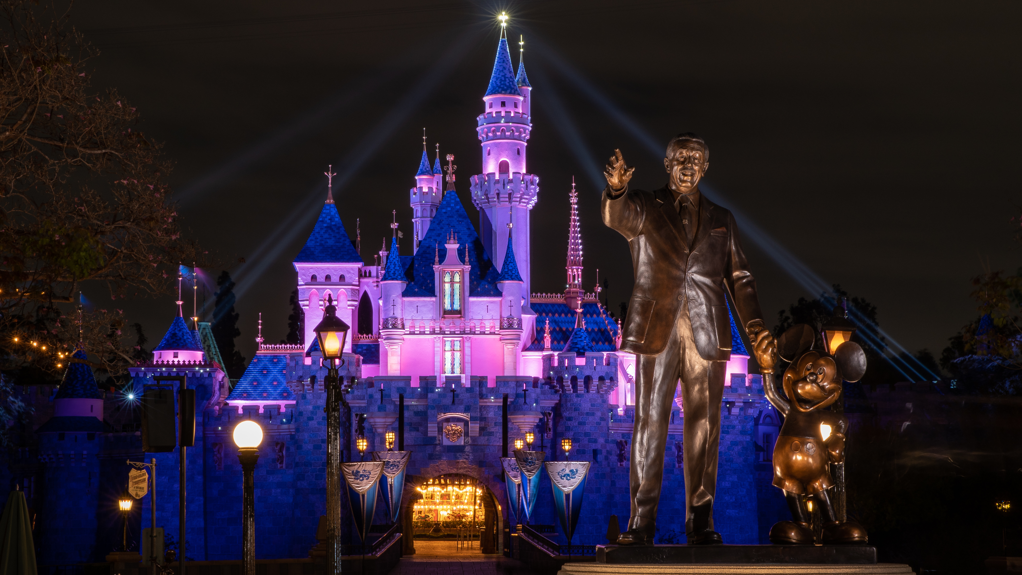 ANAHEIM, CA - APRIL 26: In this handout photo provided by Disneyland Resort, a view of Sleeping Beauty Castle in Disneyland Park illuminated during a special live streamed moment to welcome Cast Members back to the resort on April 26, 2021 at Disneyland Resort in Anaheim, California. Disneyland Resort theme parks will reopen to guests on Friday, April 30, 2021. (Photo by Christian Thompson/Disneyland Resort via Getty Images)