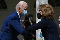 Biden greets former U.S. Rep. Gabrielle Giffords after speaking Thursday about gun violence prevention in the White House Rose Garden. Giffords and other advocates in favor of stricter gun laws attended the announcement. CREDIT: Brendan Smialowski/AFP via Getty Images