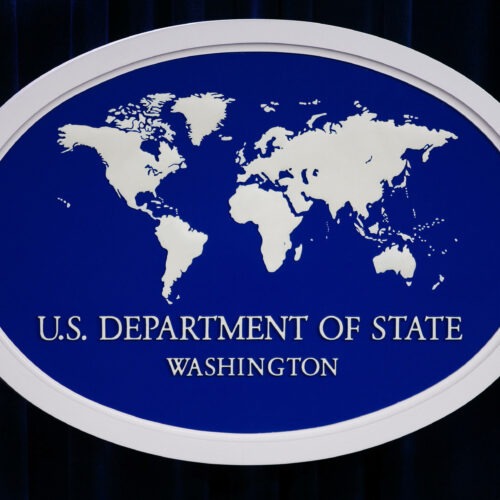 U.S. State Department logo and podium