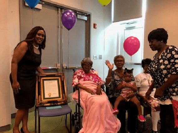 Hester Ford (center) celebrates her birthday in 2019 with her family members. Ford died last Saturday at 115 or 116. CREDIT: Tanisha Patterson-Powe