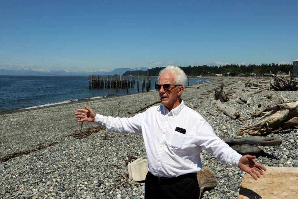 Point Roberts Chamber of Commerce President Brian Calder at a beach left deserted by cross-border travel restrictions. CREDIT: Tom Banse/N3
