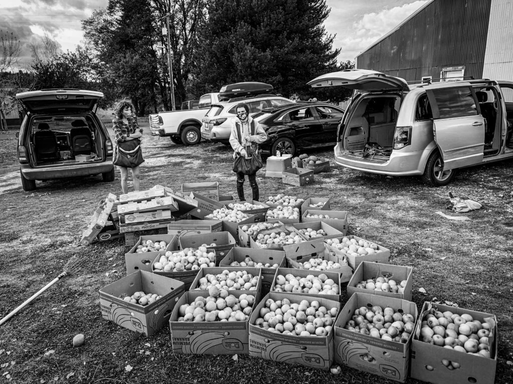 A photo of a couple of volunteers who helped glean apples for Backyard Harvest.