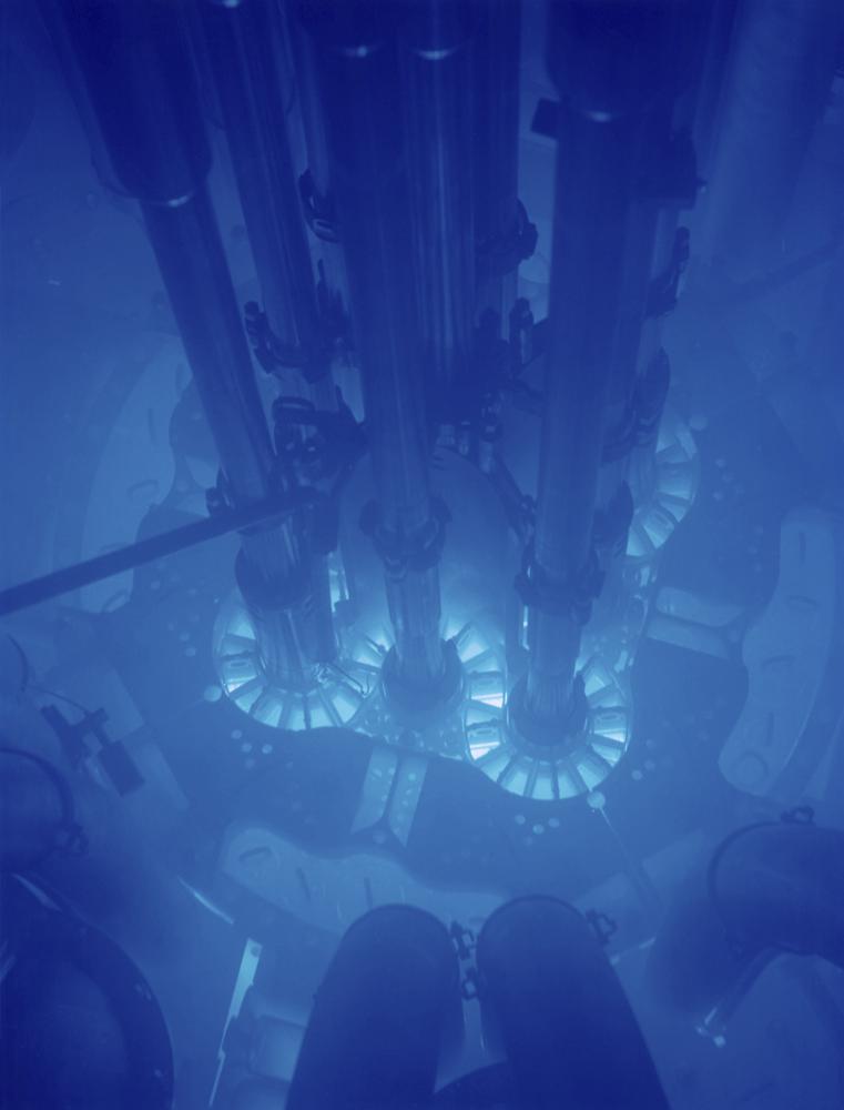 In this April 8, 2009 photo released by Idaho National Laboratory, the Advanced Test Reactor's distinctive cloverleaf core at Idaho National Laboratory's desert site about 50 miles west of Idaho Falls, Idaho. The blue Cherenkov glow indicates the reactor is in operation. The experiment in-pile tubes are the long tubes extending down into the core from the top of the frame. CREDIT: Idaho National Laboratory via AP