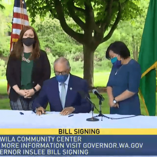Gov. Jay Inslee on May 4, 2021, signed into law a new capital gains tax and an expanded version of the state's Working Families Tax Exemption which has never before been funded. CREDIT: TVW/screenshot