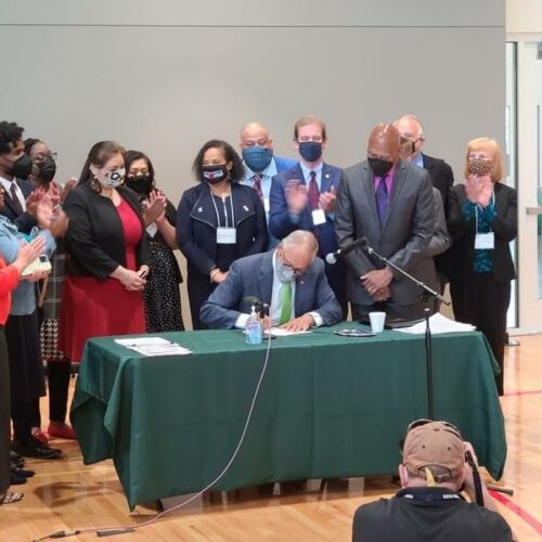 Gov. Jay Inslee signed into law a suite of police accountability bills Tuesday, May 18, 2021 at a bill signing ceremony in Tacoma. CREDIT: Kari Plog/KNKX