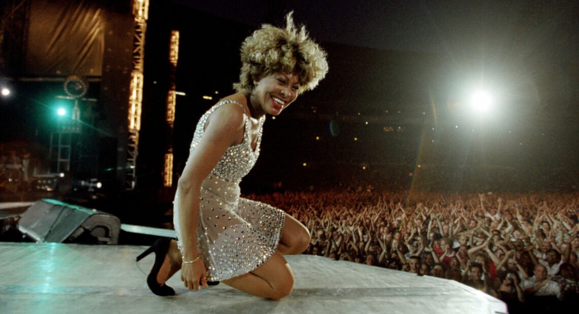 Tina Turner on stage during her concert at Wembley Stadium in London, England, as part of her Wildest Dreams World Tour, 20th July 1996. Commencing in the spring of 1996 The Wildest Dreams Tour would last for 16 months, and included more than 250 concert dates in Europe, North America and Australasia. (Photo by Duncan Raban/Popperfoto via Getty Images)