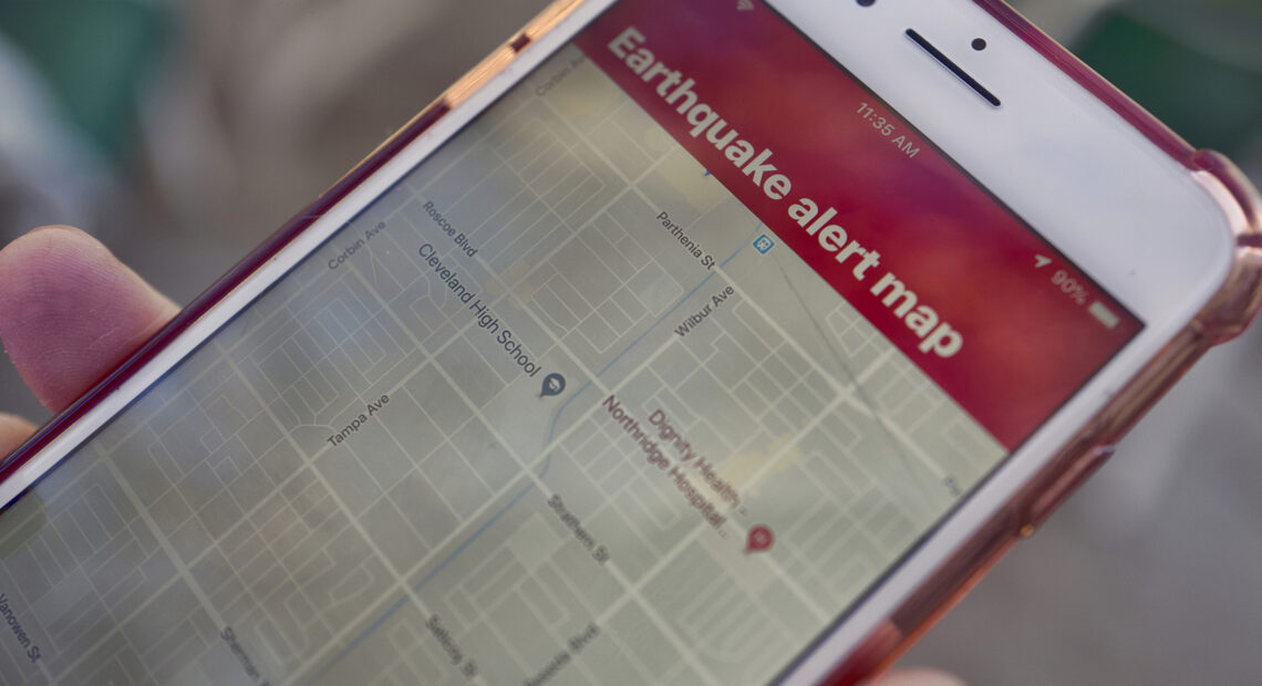 A mobile phone customer in Los Angeles looks at an earthquake warning application on an iPhone. An earthquake early warning system operated by the U.S. Geological Survey has been activated in Oregon, California and now Washington. Richard Vogel/AP