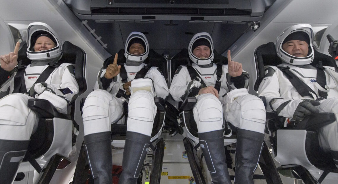 NASA astronauts Shannon Walker (left), Victor Glover, and Mike Hopkins, along with Japan Aerospace Exploration Agency astronaut Soichi Noguchi, are seen inside the SpaceX Crew Dragon Resilience spacecraft onboard the SpaceX GO Navigator recovery ship shortly after landing in the Gulf of Mexico off the coast of Panama City, Fla., on Sunday. CREDIT: Bill Ingalls/AP