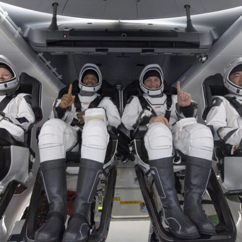 NASA astronauts Shannon Walker (left), Victor Glover, and Mike Hopkins, along with Japan Aerospace Exploration Agency astronaut Soichi Noguchi, are seen inside the SpaceX Crew Dragon Resilience spacecraft onboard the SpaceX GO Navigator recovery ship shortly after landing in the Gulf of Mexico off the coast of Panama City, Fla., on Sunday. CREDIT: Bill Ingalls/AP