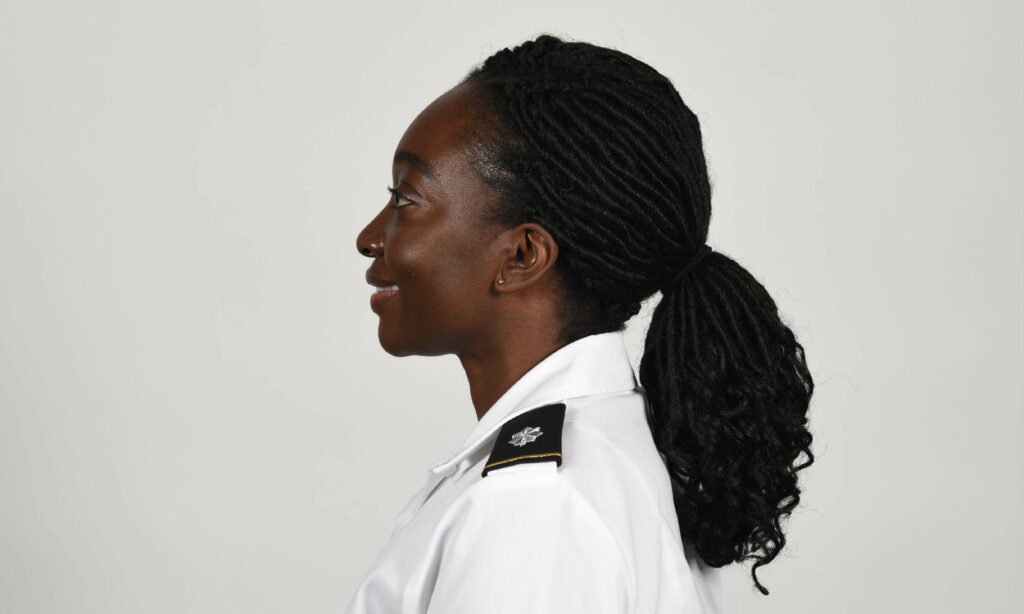 An Army photo shows a soldier wearing a new approved ponytail hairstyle. U.S. Army