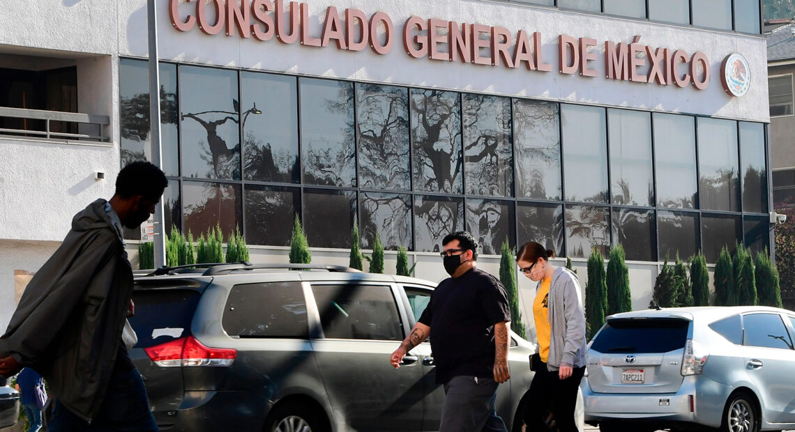 Pedestrians walk past Mexico's Consulate General in Los Angeles in October, shortly after ex-Mexican Defense Secretary Salvador Cienfuegos Zepeda's arrest at Los Angeles International Airport at the DEA's request. Charges were later dropped. Frederic J. Brown/AFP via Getty Images