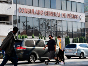 Pedestrians walk past Mexico's Consulate General in Los Angeles in October, shortly after ex-Mexican Defense Secretary Salvador Cienfuegos Zepeda's arrest at Los Angeles International Airport at the DEA's request. Charges were later dropped. Frederic J. Brown/AFP via Getty Images