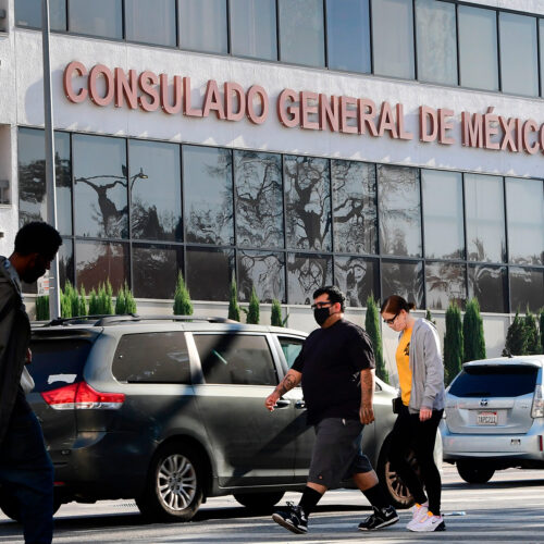 Pedestrians walk past Mexico's Consulate General in Los Angeles in October, shortly after ex-Mexican Defense Secretary Salvador Cienfuegos Zepeda's arrest at Los Angeles International Airport at the DEA's request. Charges were later dropped. Frederic J. Brown/AFP via Getty Images