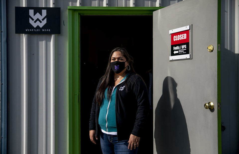 Co-founder of R Digital Design and Wenatchi Wear, Mary Big Bull-Lewis outside of her warehouse in Wenatchee on March 2, 2021. She started her companies with her husband, Rob Lewis, and aims to educate people about Wenatchi history through their designs and apparel. CREDIT: Dorothy Edwards/Crosscut