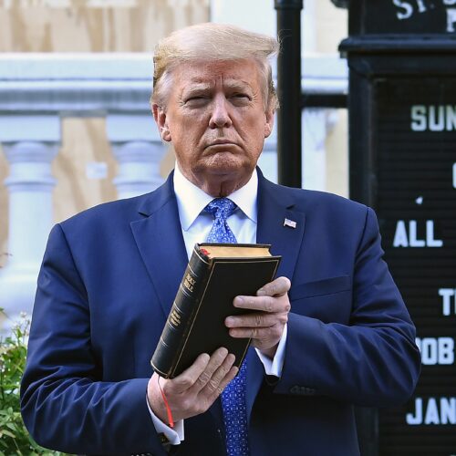Then-President Donald Trump holds up a Bible outside St. John's Episcopal Church in Washington, D.C., last June after days of anti-racism protests against police brutality. President Biden has rescinded several orders Trump made during his last year in office, including moves to protect Confederate statues targeted by protesters. Brendan Smialowski/AFP via Getty Images