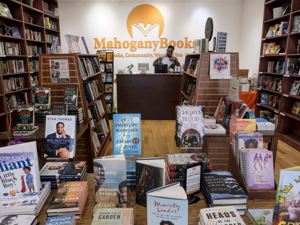 Derrick Young, co-owner of Mahogany Books in Washington, D.C., says his store has seen new customers in the last year who seem to be "willing to do the work" to educate themselves on issues of race in America. Bonnie Jo Mount/Getty Images