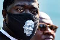 Brandon Williams, Floyd's nephew, looks on outside the White House as family members speak with reporters Tuesday after the meeting. CREDIT: Jim Watson/AFP via Getty Images