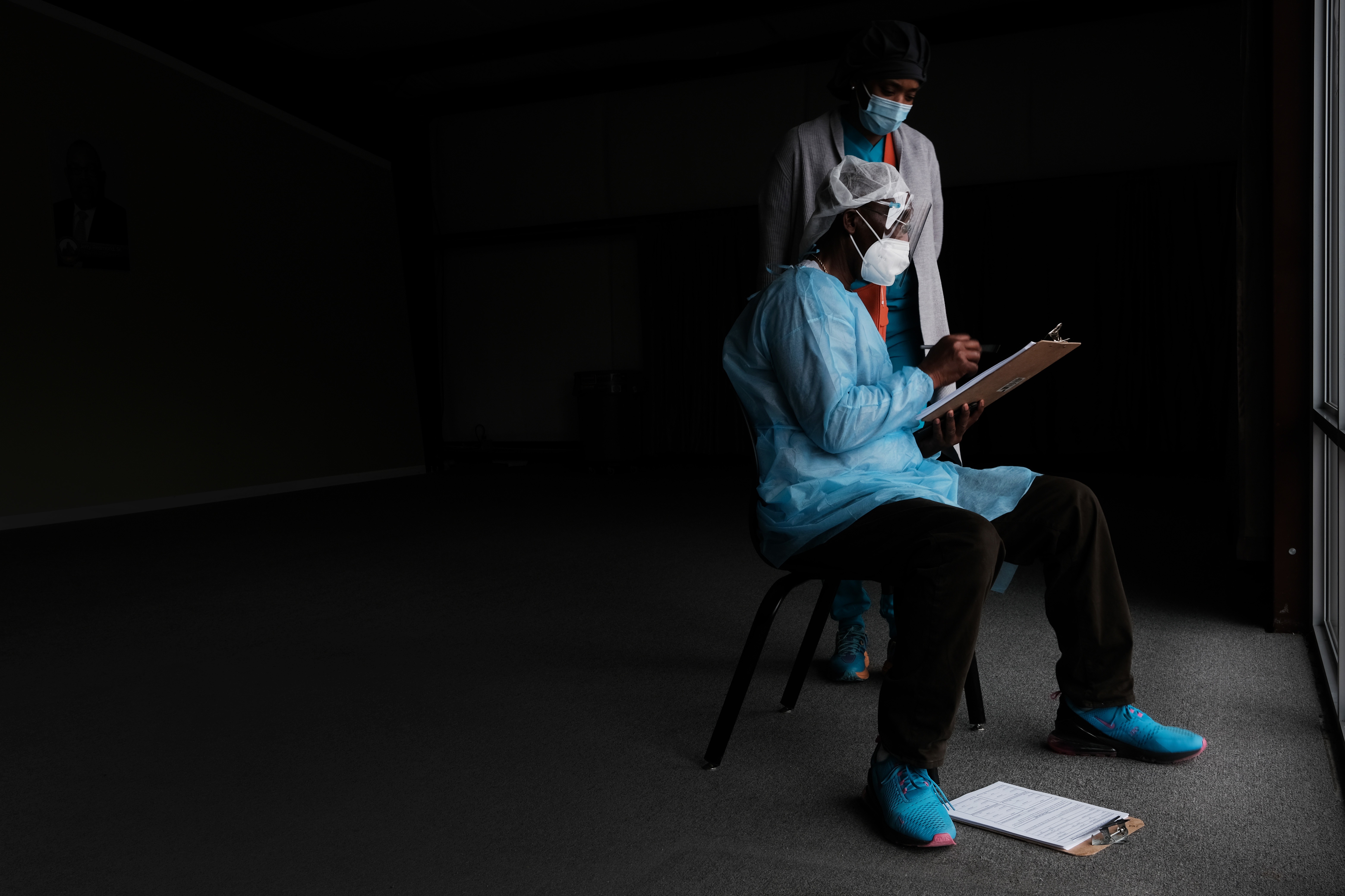 Medical workers wait to vaccinate people at a pop-up COVID-19 vaccination clinic last month in Hollandale, Miss. Spencer Platt/Getty Images