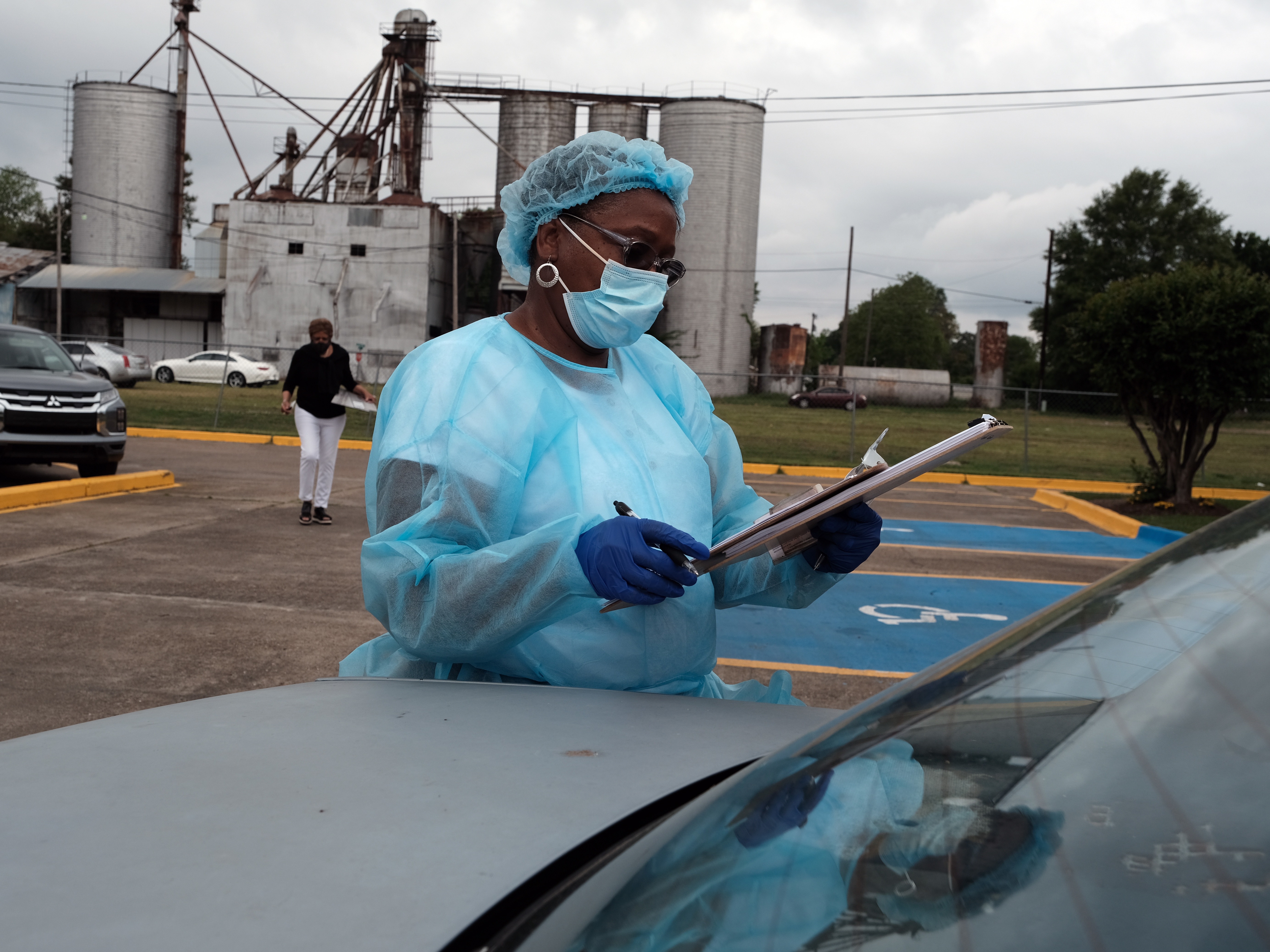 Medical workers with Delta Health Center prepare to vaccinate people in Leland, Miss., last week. In some places, rural hospital workers have been slow to get the vaccine themselves. Spencer Platt/Getty Images