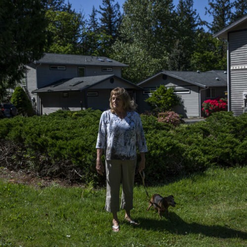 Carol Porter outside of her former home in Issaquah that she lived in for 25 years, May 17, 2021. Porter lost her home when she filed for bankruptcy in 2015 because the Washington law meant to prevent this from happening had not kept up with rising home prices. A new law aims to keep people in their homes if they file for bankruptcy, raising the protected amount to better match King County’s median home price. CREDIT: Dorothy Edwards/Crosscut