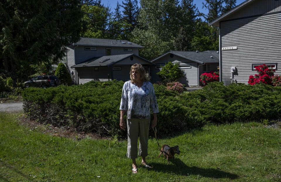 Carol Porter outside of her former home in Issaquah that she lived in for 25 years, May 17, 2021. Porter lost her home when she filed for bankruptcy in 2015 because the Washington law meant to prevent this from happening had not kept up with rising home prices. A new law aims to keep people in their homes if they file for bankruptcy, raising the protected amount to better match King County’s median home price. CREDIT: Dorothy Edwards/Crosscut