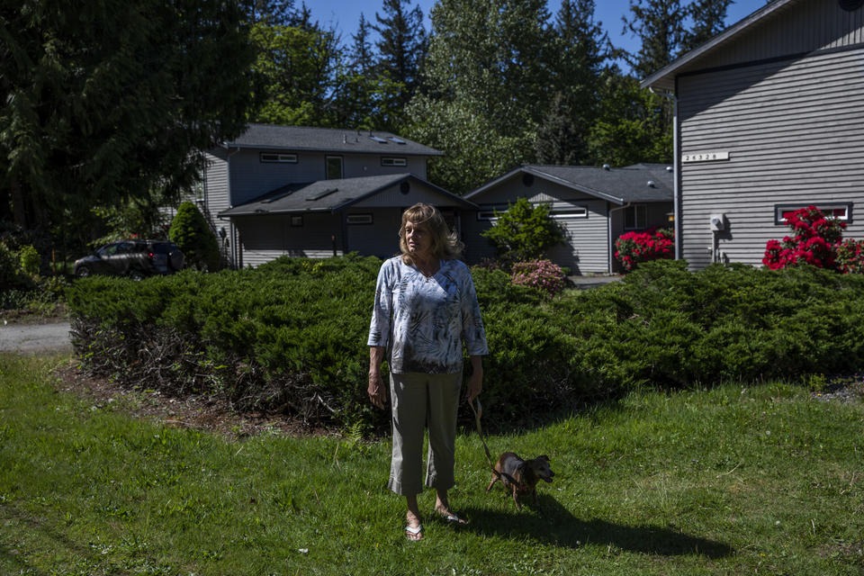 Carol Porter outside of her former home in Issaquah that she lived in for 25 years, May 17, 2021. Porter lost her home when she filed for bankruptcy in 2015 because the Washington law meant to prevent this from happening had not kept up with rising home prices. A new law aims to keep people in their homes if they file for bankruptcy, raising the protected amount to better match King County’s median home price. CREDIT: Dorothy Edwards/Crosscut