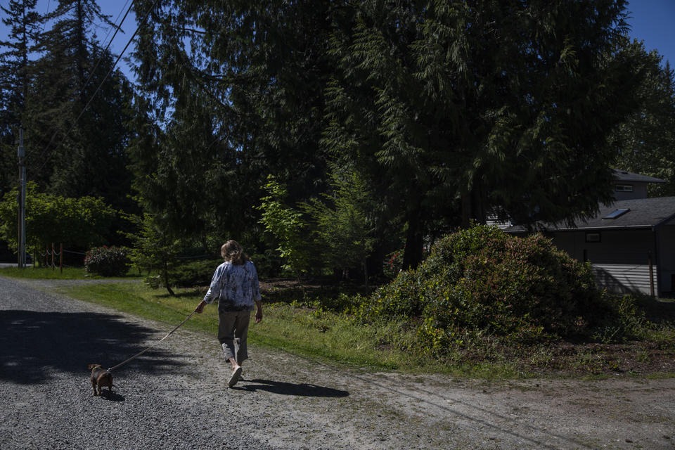Carol Porter outside of her former home in Issaquah, where she lived for 25 years. Porter lost her home when she filed for bankruptcy in 2015 because the Washington law meant to prevent this from happening had not kept up with rising home prices. CREDIT: Dorothy Edwards/Crosscut