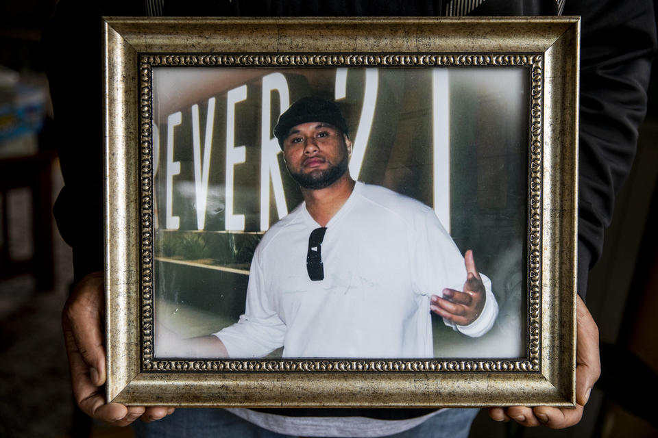 Po Leapai holds the last photo taken of his cousin, Iosia Faletogo, before he was shot and killed by a Seattle police officer in 2018. CREDIT: Dorothy Edwards/Crosscut