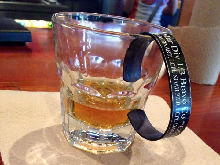 whiskey in glass with soldier tag to remember