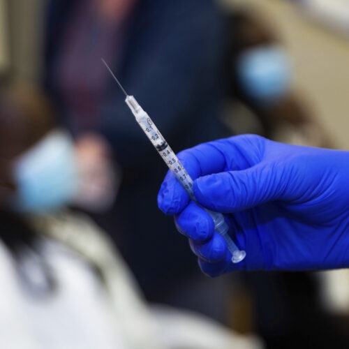 A doctor prepares to administer a vaccine injection at New York-Presbyterian Lawrence Hospital in Bronxville, N.Y., in January. The Food and Drug Administration has approved emergency use authorization of the Pfizer/BioNTech vaccine for patients ages 12 to 15. Kevin Hagen/AP