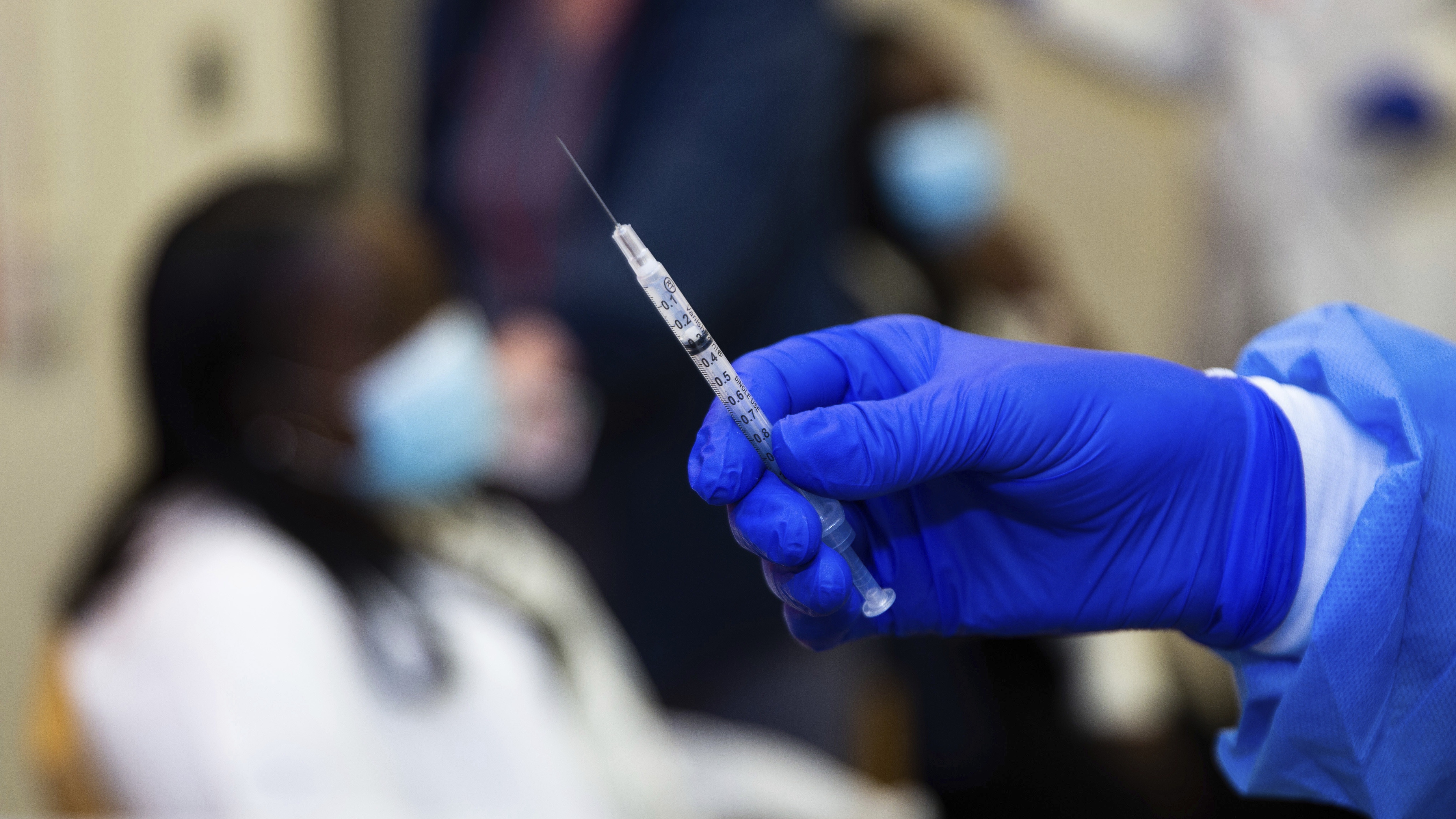 A doctor prepares to administer a vaccine injection at New York-Presbyterian Lawrence Hospital in Bronxville, N.Y., in January. The Food and Drug Administration has approved emergency use authorization of the Pfizer/BioNTech vaccine for patients ages 12 to 15. Kevin Hagen/AP