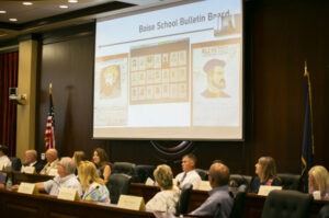 Members of the indoctrination task force look at slides presented by Rep. Priscilla Giddings Thursday. Nik Streng/Idaho Education News