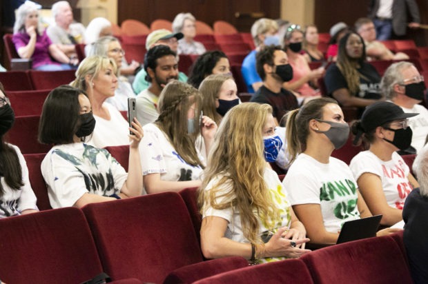 Local students wore shirts reading “hands off our schools” during the task force meeting Thursday. CREDIT: Nik Streng/Idaho Education News