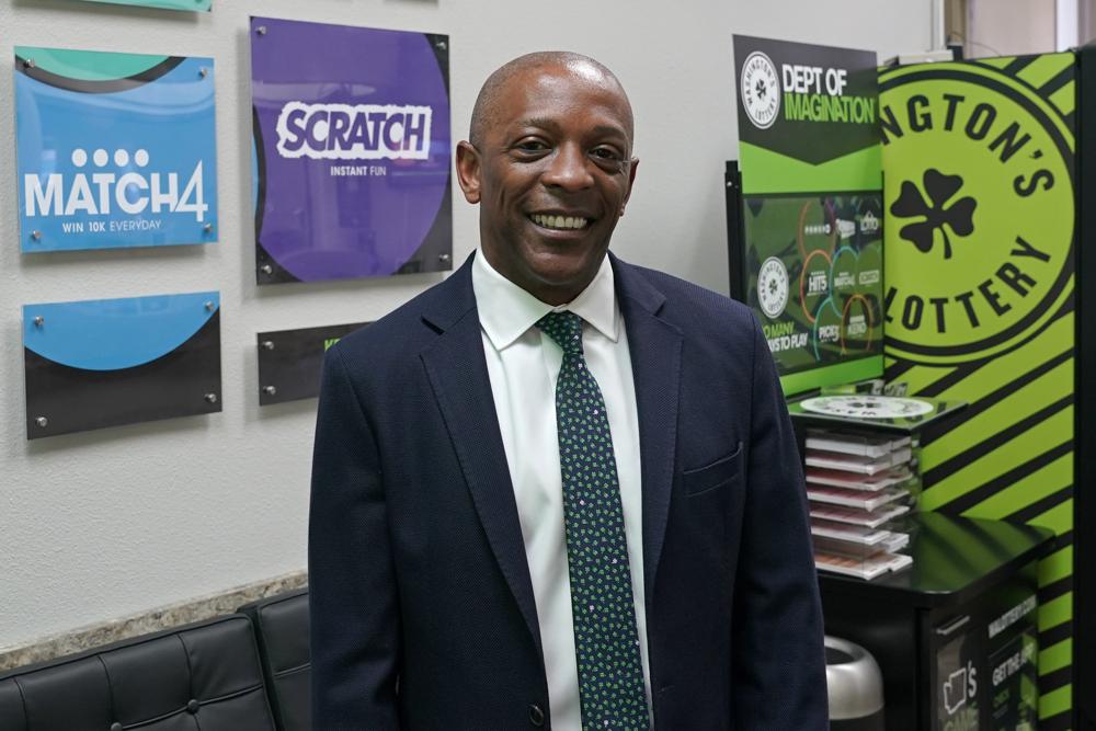 Marcus Glasper, director of the Washington State Lottery, poses for a photo, Thursday, June 3, 2021, in Olympia, Wash. Gov. Jay Inslee announced the same day that Washington is the latest state to offer prizes to encourage people to get vaccinated against COVID-19. Incentives will include a series of giveaways during the month of June including lottery prizes totaling $2 million, college tuition assistance, airline tickets and game systems. CREDIT: Ted S. Warren/AP