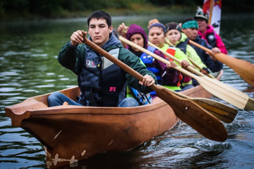 Nez Perce tribal members paddle on the Snake River in a canoe they carved as part of a culture and environmental learning project supported by the Potlatch Fund.