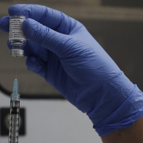 A vial of the Phase 3 Novavax coronavirus vaccine is seen ready for use in the trial at St. George's University hospital in London Wednesday, Oct. 7, 2020. Novavax Inc. said Thursday Jan. 28, 2021 that its COVID-19 vaccine appears 89% effective based on early findings from a British study and that it also seems to work — though not as well — against new mutated strains of the virus circulating in that country and South Africa. (AP Photo/Alastair Grant)