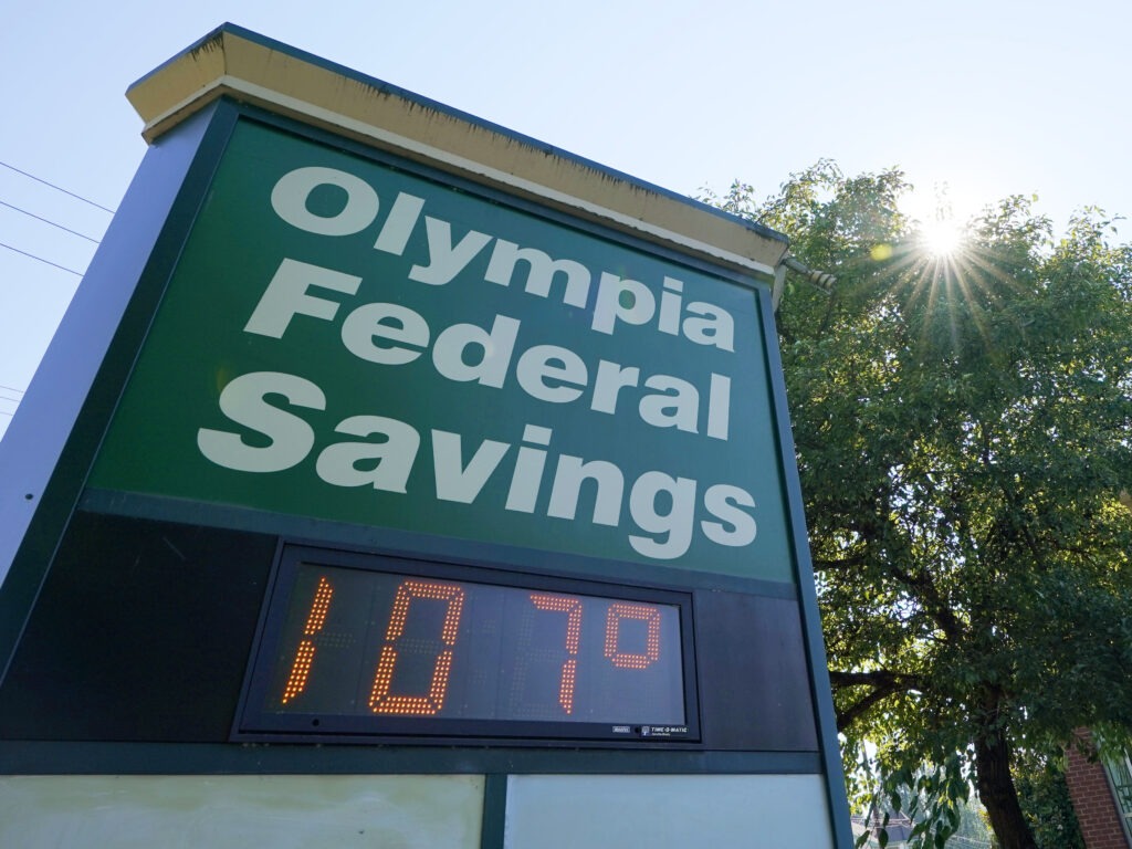 A display at an Olympia Federal Savings branch shows a temperature of 107 degrees Fahrenheit on Monday in the early evening in Olympia, Wash. CREDIT: Ted S. Warren/AP