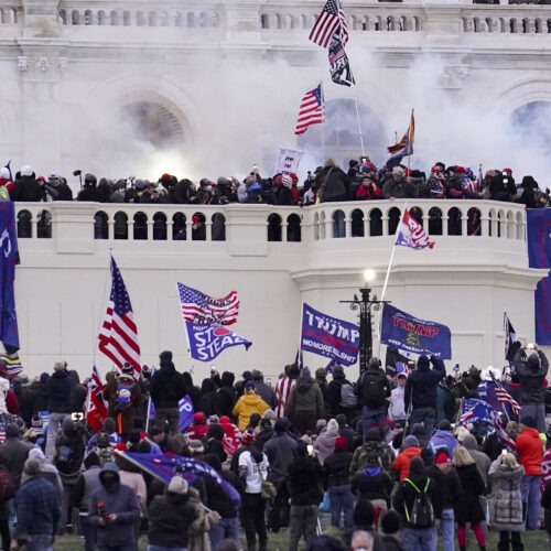 Violent rioters supporting then-President Donald Trump storm the U.S. Capitol on Jan. 6. Capitol Police had seen information from a pro-Trump website that encouraged demonstrators to bring weapons to subdue members of Congress and police. CREDIT: John Minchillo/AP