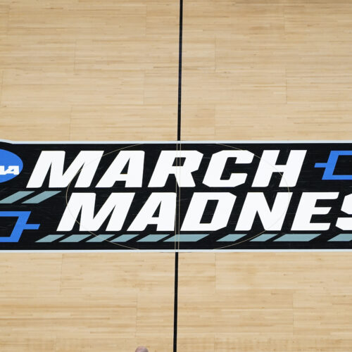 The March Madness logo on the court during a men's college basketball game during the NCAA tournament in Indianapolis. The Supreme Court has eroded the difference between elite college athletes and professional sports stars.